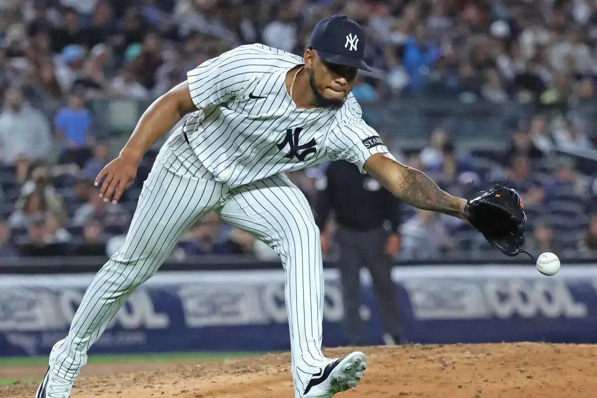 Camilo Doval can't field a ball during the Yankees' loss to the Red Sox on Aug. 21.