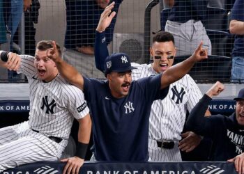 Trent Grisham and the Yankees dugout celebrates as Jose Caballero's walk-off double capped a wild 5-4 Yankees win over the Angels in New York, Apr. 15, 2026.